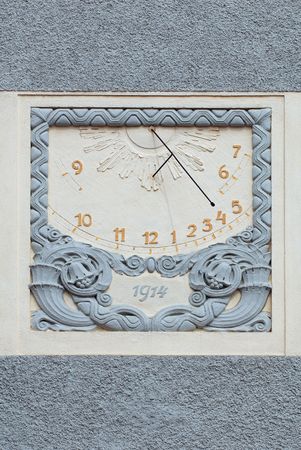 Sun dial on a wall of an old castle in Hluboka nad Vltavou, Czech Republicの写真素材