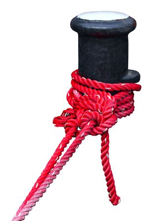 Berthing curbstone with the reeled up red rope の写真素材