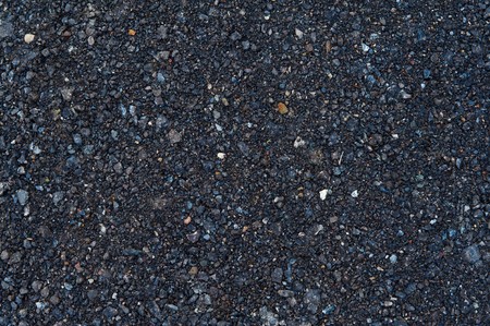 Fresh asphalt texture with stones for use as backgroundの写真素材
