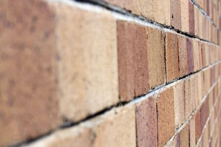 Close up shot of a brick wall with a shallow depth of field focus.の写真素材