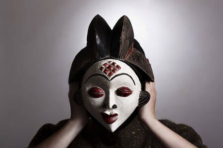 Woman with African maskの写真素材