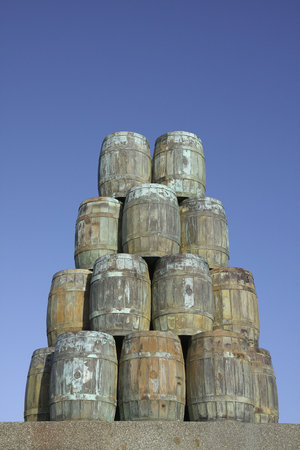 Huge hip of old barrels standing in shipyard
