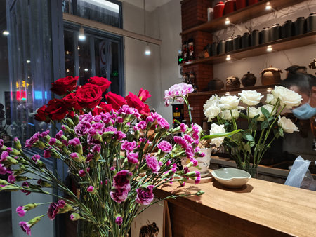 Bouquet of red and white flowers in a shop windowの写真素材