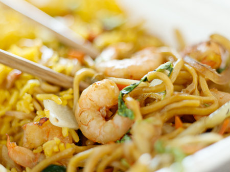 shrimp lo mein with fried rice with extremly thin focus and blurry background.の写真素材