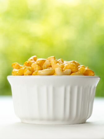 macaroni and cheese closeup with summer green backgroundの写真素材