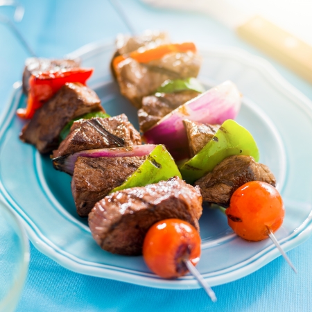 grilled beef shishkabobs on tableの写真素材
