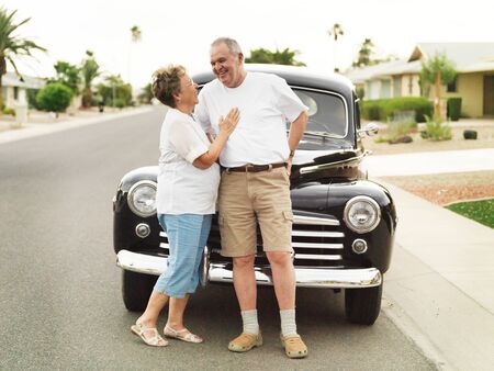 senior couple with vintage carの写真素材