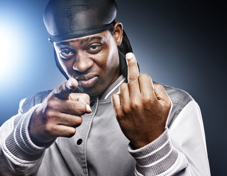 african man giving middle finger in studio shot