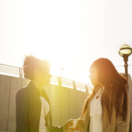 two sisters having fun around townの写真素材