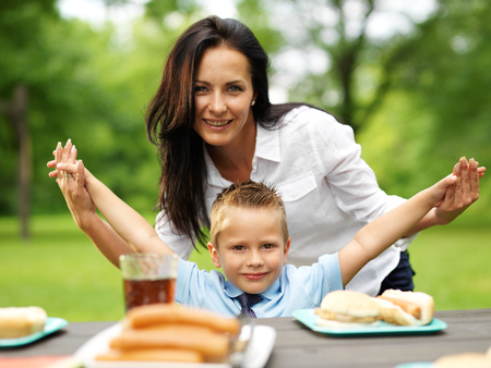 mother and son at picnic in parkの写真素材