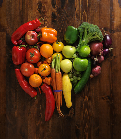vegetables on cutting board shaped like heartの写真素材