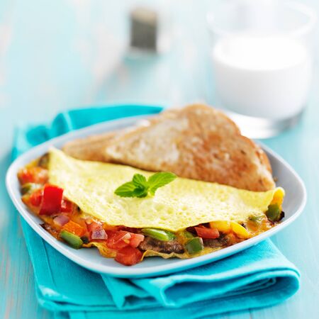 breakfast omelette with vegetables and cheeseの写真素材