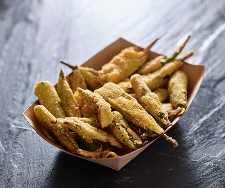 crispy fried okra in containerの写真素材