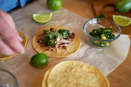 making tacos at home in kitchenの写真素材