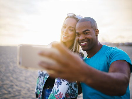 couple taking a break from riding bikes to take selfies
