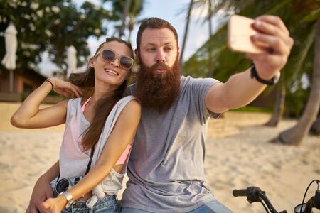 tourist couple taking selfie in thailandの写真素材