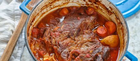 beef roast baked in dutch oven with rosemaryの写真素材