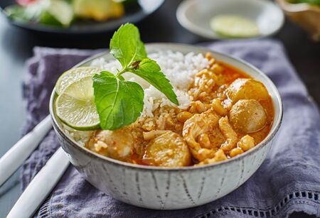 thai massaman chicken curry in bowl with jasmine riceの写真素材