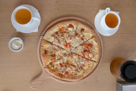 two white cups with tea pizza sauce in a cafe on the table top view lunch food snack dinner afternoon teaの写真素材