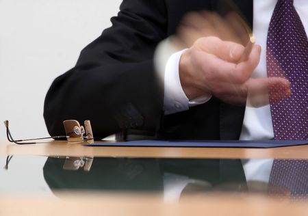 hands of a businessman on signing of contractの写真素材