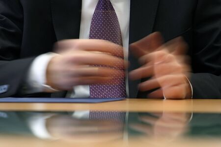 hands of a businessman on signing of contractの写真素材