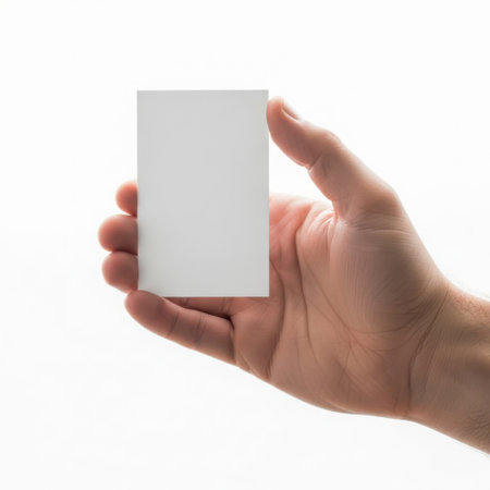 Hand holding a blank white cardの素材