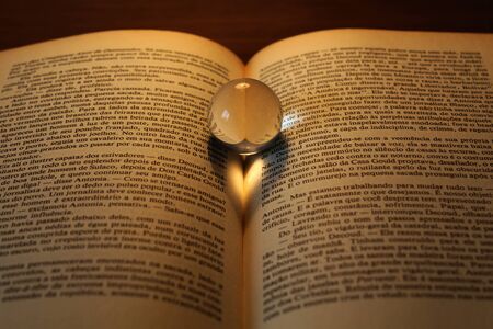 Shadow of a heart on the pagesの写真素材