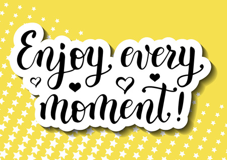 Modern calligraphy lettering of motivational quote Enjoy every moment decorated with hearts in black with shadows on yellow background with white stars for poster, sticker, postcard, decorationのイラスト素材