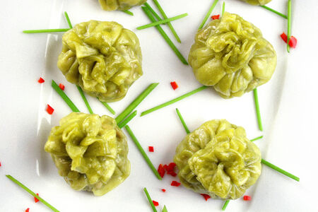 Chinese Dim Sum with soy sause on a white plateの写真素材