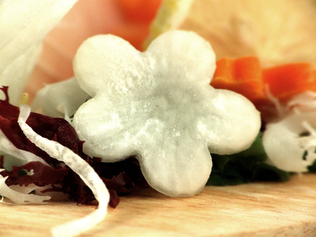 Beautiful daikon flower decorates salad and rollの写真素材