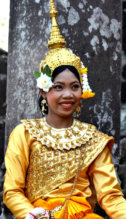 Angkor-Tom Combodia smilinig girl in traditional costumeのeditorial素材
