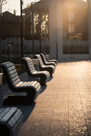 Park benches and seats in a park, sunny spring day