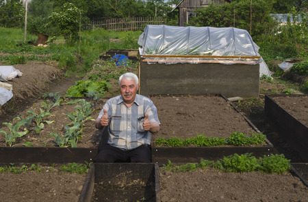 The man in the country satisfied with the beds made.の写真素材