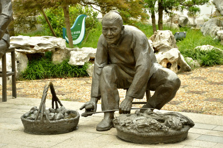 Statue of a grandmother selling vegetableのeditorial素材