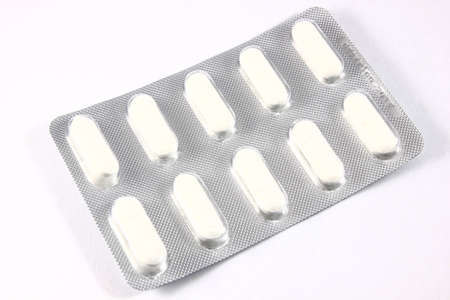 Pills to medicate and cure ills or to Birth control in blister packの写真素材