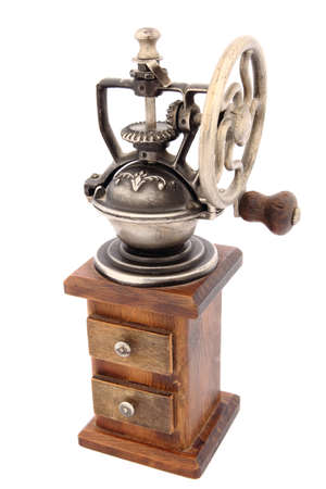 Antique brown coffee grinder on a white backgroundの写真素材