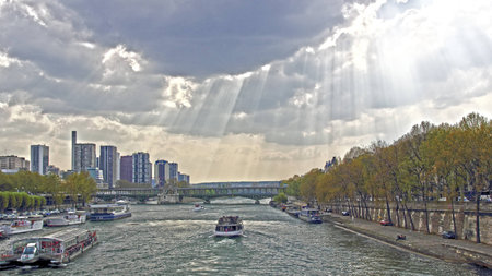 Seine River and Paris skyline at background on a cloudy day