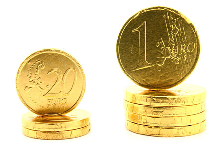 Two Stacks of coins of Euro currency on white.の写真素材