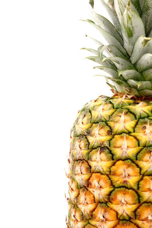 A piece of pineapple isolated on a white background.の写真素材