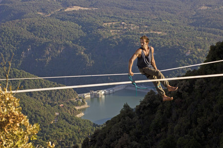 TAVERTET, BARCELONA - AUGUST 02: Man practicing highline on August 9, 2012 in Tavertet, Spain. 