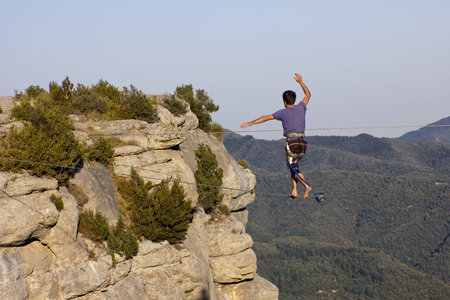 TAVERTET, BARCELONA - AUGUST 02: Man practicing highline on August 9, 2012 in Tavertet, Spain. 