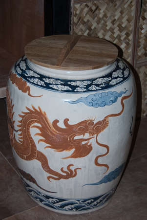 Golden Dragon jar with blue dragon painting in Thai style bathroomの写真素材