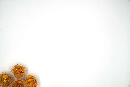Top view of honey cornflakes in a paper cup over white backgroundの写真素材