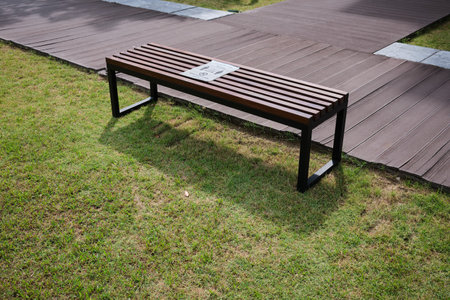 Brown bench at the park with social distancing stickerの写真素材