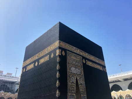 Wide angle view of Kaaba during the day against the blue skyのeditorial素材
