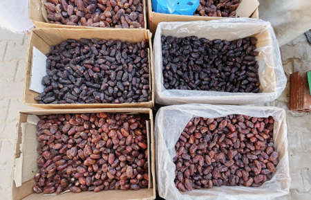 Wide angle top view of multiple types of dates sold in the marketの写真素材