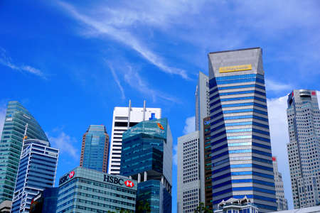 Multiple skyscrapers of famous company in the city of Singapore during the dayのeditorial素材