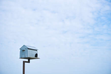Tall wooden bird house in the middle of paddy fields in Sekinchan, Malaysiaの写真素材