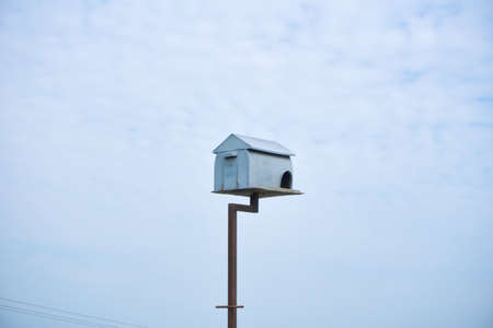 Tall wooden bird house in the middle of paddy fields in Sekinchan, Malaysiaの写真素材