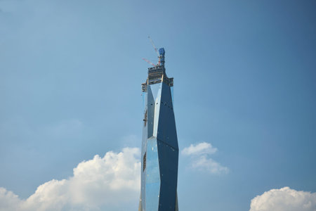Low angle view of Merdeka PNB118 in construction against the sky during the day